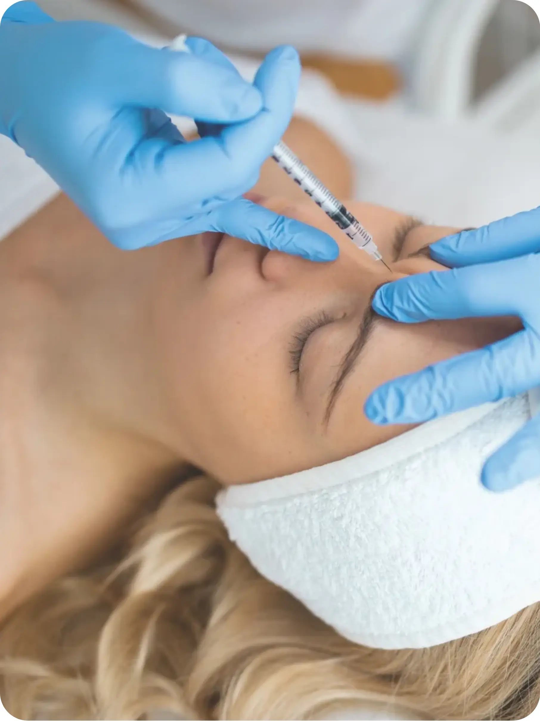 Patient receiving aesthetic treatment